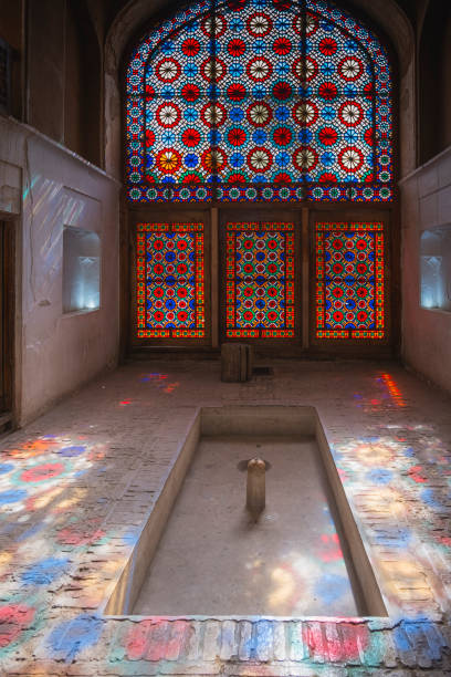 istock Sunlight shining through stained glass windows illuminating traditional iranian house 2196618689