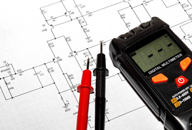 istock Red and black probes and a multimeter 2196618982