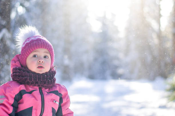 istock A child in a sunny snow forest 2196626907