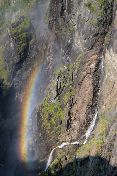 istock This image captures a stunning rocky cliff side with cascading waterfalls and vibrant green moss. 2196627339