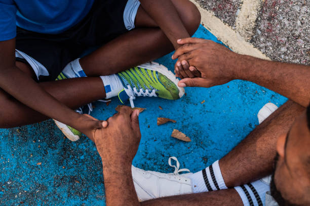 Father and son holding hands outdoors