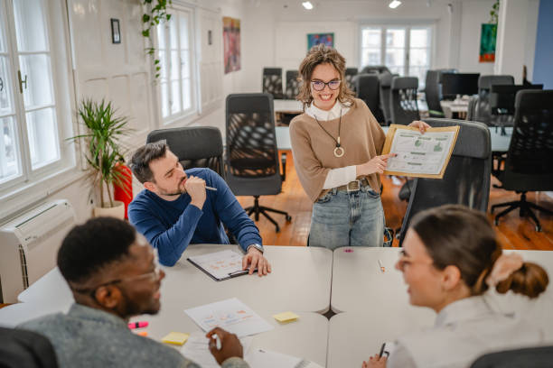istock young businesswoman representing statistics to her work team 2196628855