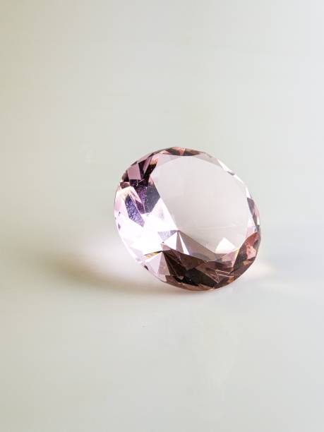 Pink crystal crystal on a white background. Close-up.
