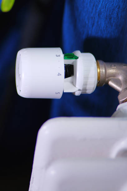 istock Thermostat close-up showing temperature regulation knob 2196638909