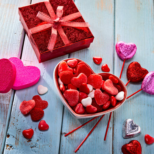 Valentines Day Candy and Decorationd for a Party on Retro Wood Background