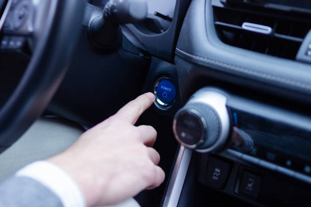 istock Businessman starting modern car pushing power button 2196643912