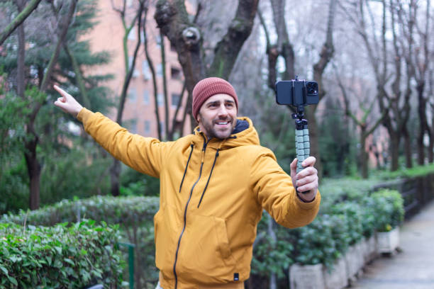 istock Influencer creating content with smartphone gimbal in the city park 2196644032