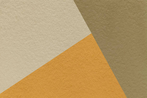 istock Texture craft beige, brown and yellow shade paper background, macro. Structure vintage ocher abstract cardboard 2196646817