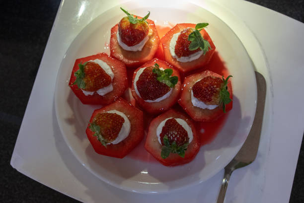 Traditional Turkish style quince dessert. The quince is cooked until soft, sherbet is poured on it, and served with cream and walnuts. It is one of the most popular Turkish desserts.