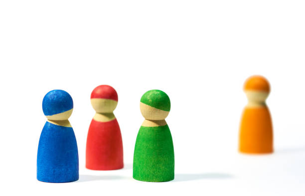 Colorful wooden figures symbolizing community and individuality. Isolated on white background with copy space for text inclusion.