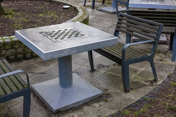 Empty street chess table and benches in a city park. High quality photo