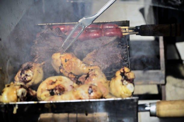 istock Turning the meats while roasting on the barbecue 2196659993