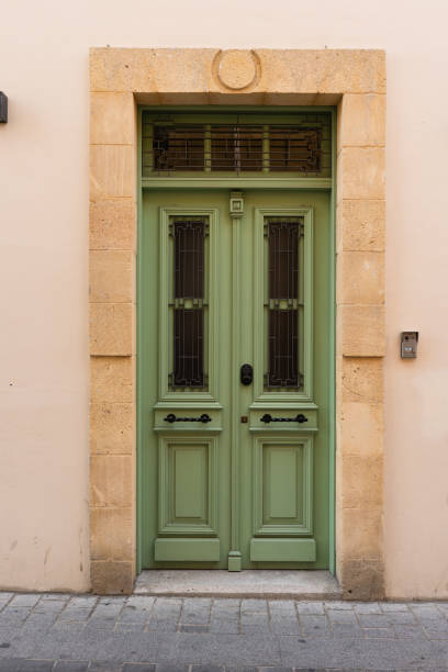istock House facade with Mediterranean styled green door 2196660177