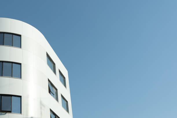 istock New building architecture on blue sky background,Low angle architectural exterior view of modern,copy space foe text 2196660190