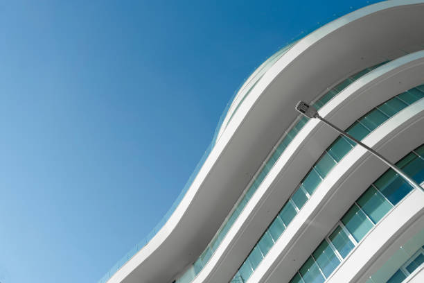 istock New building architecture on blue sky background,Low angle architectural exterior view of modern,copy space foe text 2196660196