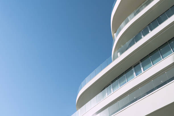 istock New building architecture on blue sky background,Low angle architectural exterior view of modern,copy space foe text 2196660209