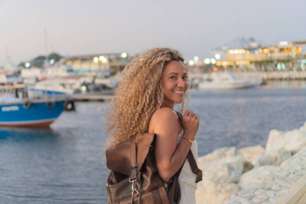 istock Tourist smiling at the camera in a marina 2196661025