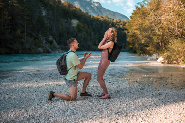 istock Caucasian Man Proposing to Caucasian Girlfriend by River 2196662043
