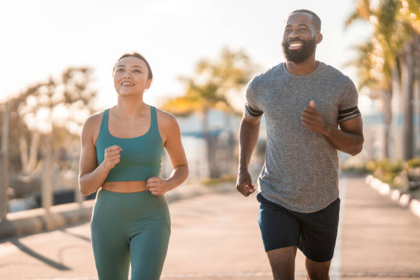 istock Active Joggers Enjoying Morning Run in Urban Setting 2196663485