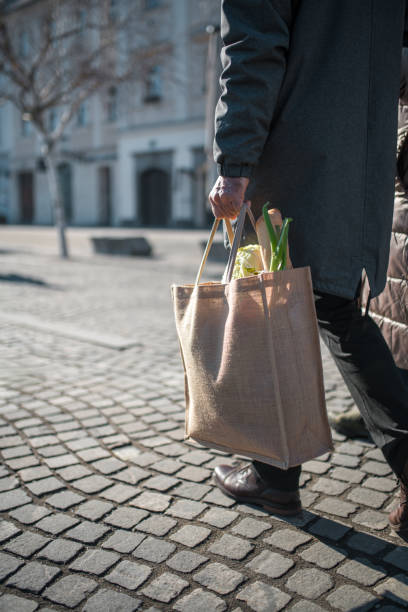 istock Mature Caucasian Man with Sustainable Grocery Bag Outdoors 2196663607