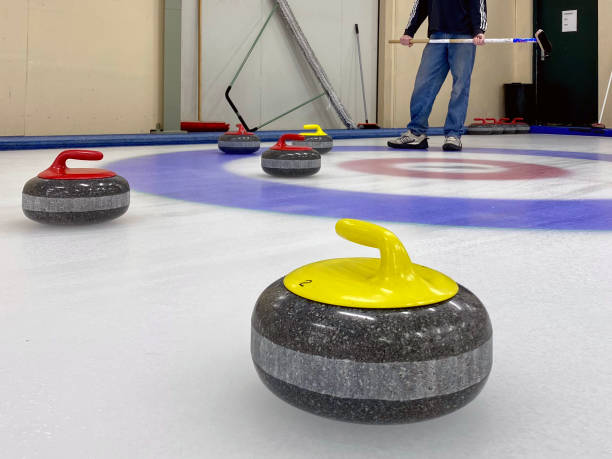 istock Curling at an indoor ice rink 2196664100