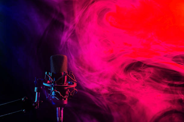 istock Professional microphone in red blue smoke on a black background. 2196667586