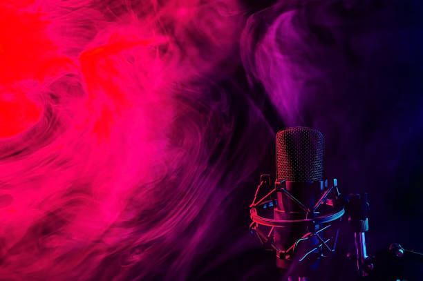 istock Professional microphone in red blue smoke on a black background. 2196667634