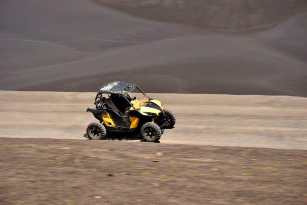 istock offroad quad passing on a desert trail 2196671613