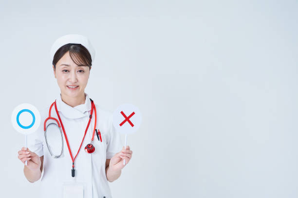 A woman in a white lab coat holding plates with marks written on it and white background