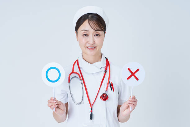 A woman in a white lab coat holding plates with marks written on it and white background