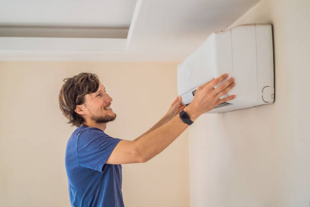 istock technician service removing air filter of the air conditioner for cleaning 2196683292