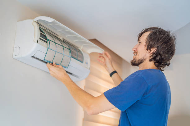 istock technician service removing air filter of the air conditioner for cleaning 2196683295