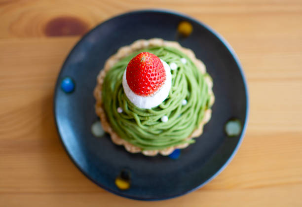 Top view of Mont Blanc matcha green tea cake on black dish