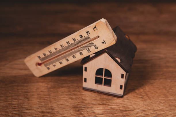istock thermometer with house temperature and hot weather 2196684128