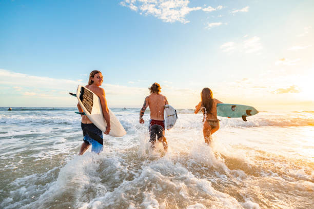 istock Surfers Enjoying Sunrise at Gold Coast Beach 2196688405