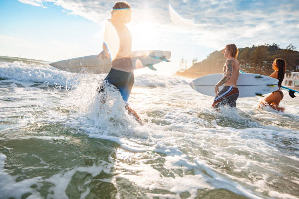 istock Surfers Enjoying Morning Waves on Gold Coast Beach 2196688421
