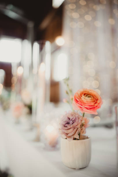 A floral display on a table at wedding reception  
