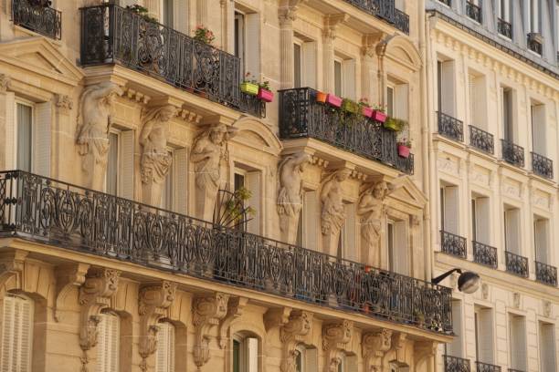 istock Elegant Parisian building facade with ornate balconies. 2196688574