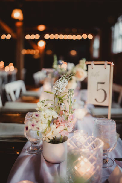 istock Long table at wedding reception dinner with candles and flowers 2196689154