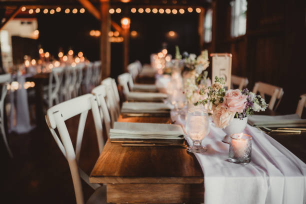 istock Elegant wedding reception dinner at wood table with sheer tablecloth decoration 2196689155