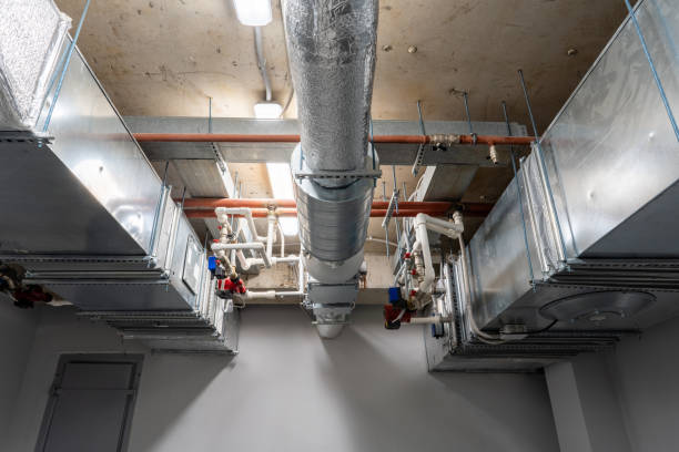 istock Modern ventilation system with exposed ducts and pipes in a commercial building 2196689842