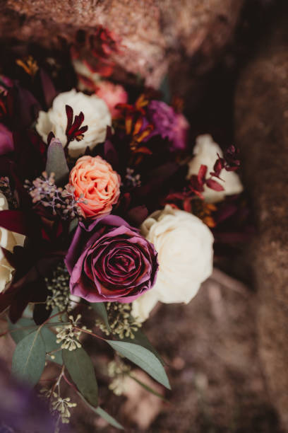 istock Bride's wedding bouquet with different colors of roses and greenery 2196689990