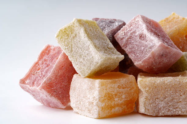 istock Colorful assortment of traditional sweets arranged on a plain background for a festive display 2196690040