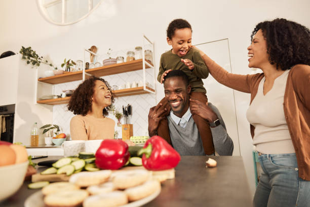 istock Happy black family having fun in the kitchen. 2196691211