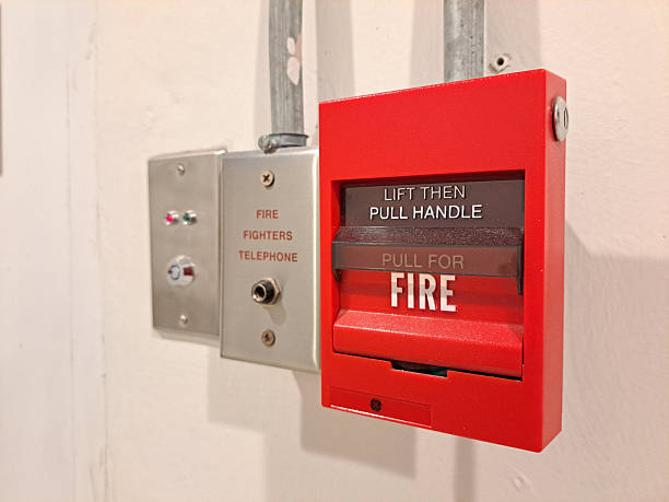 istock Fire alarm on wall. Red fire alarm switch Industrial fire warning system equipment. 2196691309