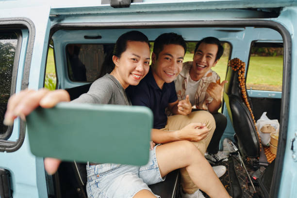 istock Girl Taking Selfie With Her Friends 2196691523