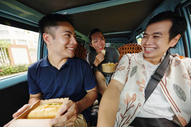 Friends Having Lunch In Car