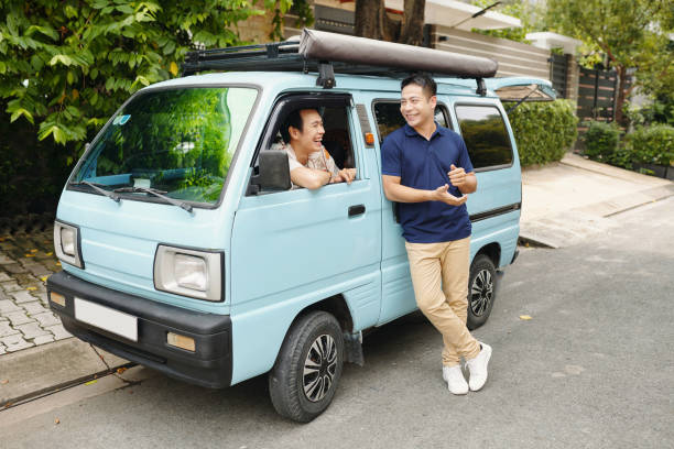 Friends talking to each other during their meeting on the road