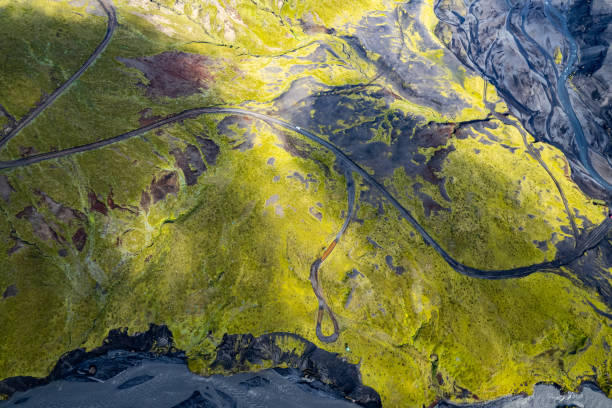 istock Aerial drone view exploring a river valley landscape with a amazing glacial basin very close to Thakgil (Pakgil) campsite near Vik in Iceland. M.ountains in the background 2196693388