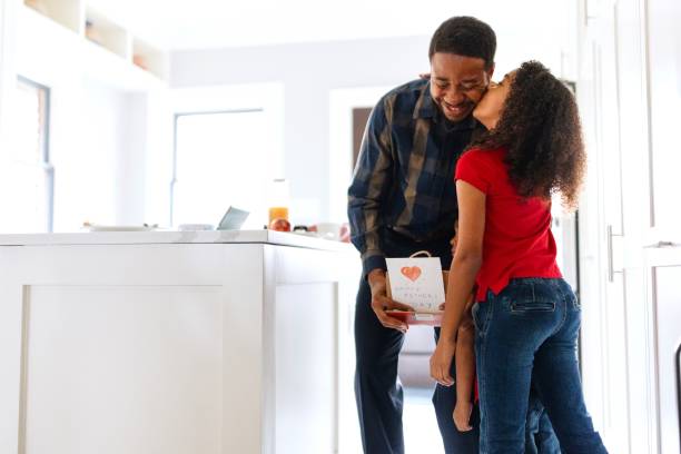 istock Daughter kissing her father on Father's day 2196694083